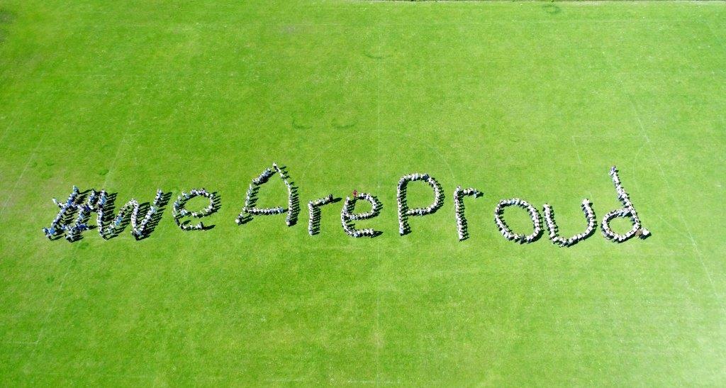 All of our children on our school field sharing an important message!